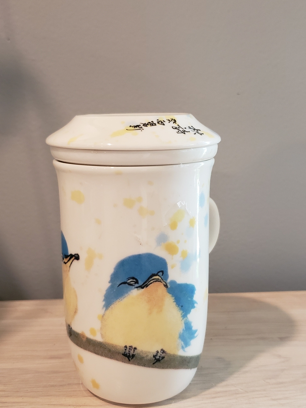 Whimsical White Ceramic Tea Infuser with Blue & Yellow Bird Motif